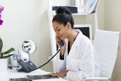 Doctor calling Universal Language Service for Support